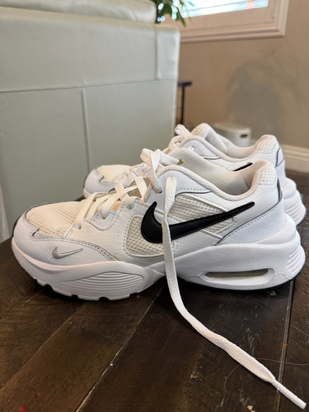 Nike White Sneakers with Black Swoosh